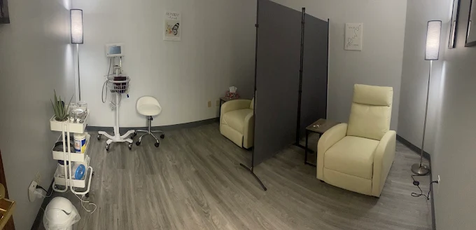 Our treatment room, with recliners, vitals equipment and privacy screens