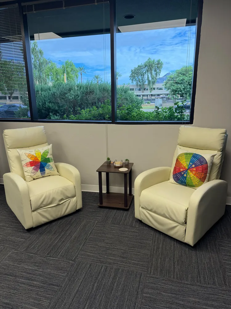 Two armchairs beside a window at our Phoenix office